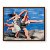 Two Women Running On The Beach - Framed Canvas